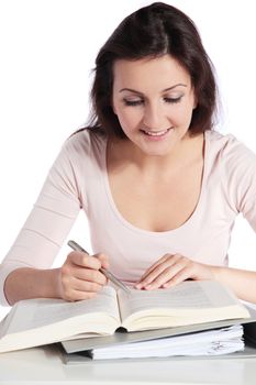 Attractive young woman studying. All isolated on white background.