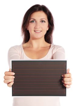 Attractive young woman holding a chalkboard. All on white background.