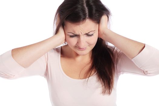 Attractive young woman suffering from tinnitus. All on white background.