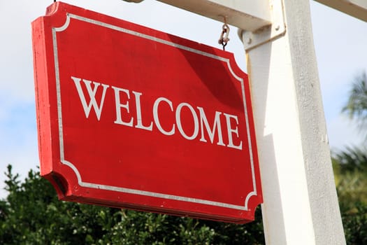 Red welcome sign.