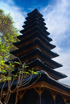 Traditional Balinese many tier palm roof of altar Meru in Goa Lawah Bat Cave temple, Bali, Indonesia