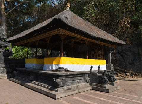 Traditional Balinese pavilion Bale Piasan for offerings in Goa Lawah Bat Cave on Sep 26, 2012 in Bali, Indonesia