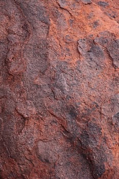 Red natural stone background texture.