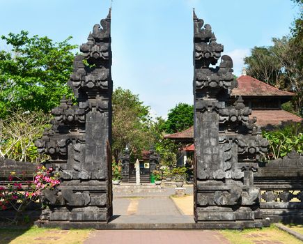 Traditional Balinese gate Candi Bentar in Goa Lawah Bat Cave temple, Bali, Indonesia