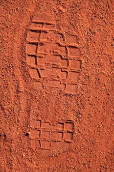 Footprint in typical red sand of central Australia.