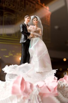 figurines of bride and groom on a wedding cake