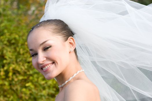 a happy bride and a flying downwind veil