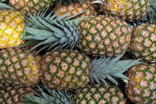 pineapples at a market stall. Background texture.