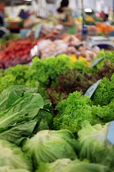 Market stall offering various vegetables.