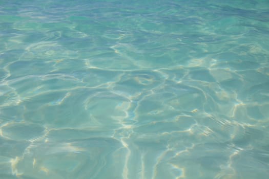 Turquoise water surface of a swimming pool.