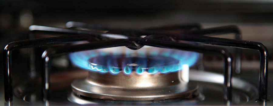 Standard gas stove with typical blue gas flame.