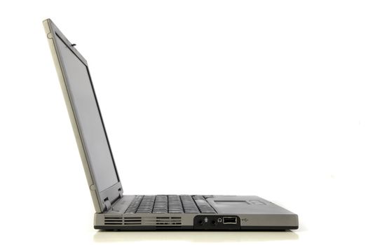 Side view of a standard notebook computer. All isolated on white background.