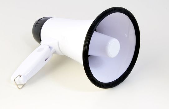 A standard megaphone. All on light grey background.