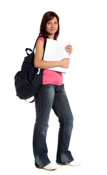 An attractive female student standing in front of a plain white background. 