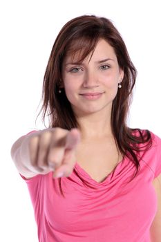 An attractive young woman pointing with finger. All on white background. 