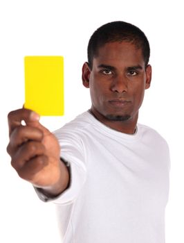 An attractive dark-skinned man showing a yellow card. All on white background. 