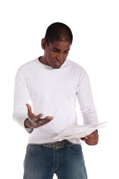 An attractive dark-skinned man getting shocking news via mail. All on white background.