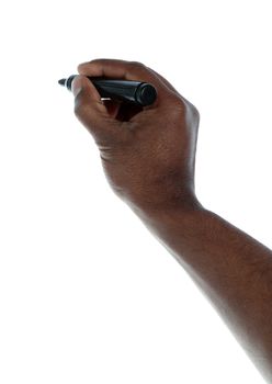 A dark-skinned human hand holding a pencil. All on white background. Image with extra copy space.