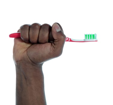 A dark-skinned hand holding a toothbrush. All on white background.