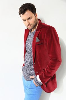 Handsome man posing in a red jacket