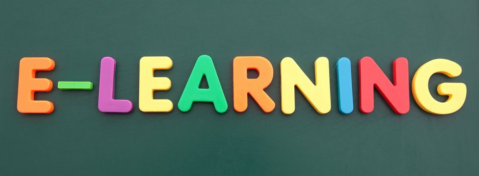 The term e-learning built out of colored bold letters on a blackboard.