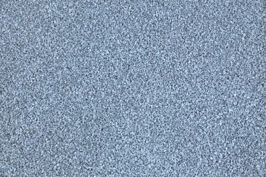 A background texture of fine gravel stones.