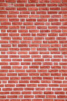 A background texture of a fine red brick wall.