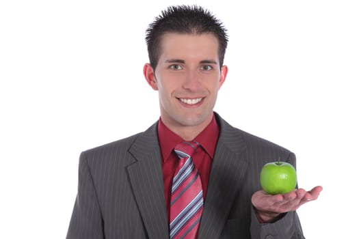 A handsome businessman holding a fine green apple. All on white background.