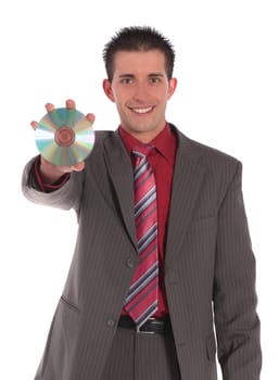 A handsome businessman holding CD or DVD. All on white background.