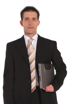 A handsome businessman holding a notebook computer. All on white background.