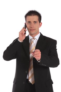 A businessman making a serious phone call and pointing with finger. All on white background.