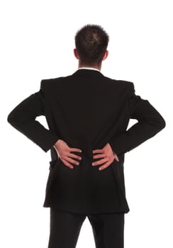 A businessman suffering from backache. All on white background.