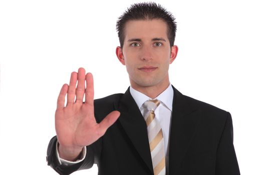 A handsome businessman making a stopping gesture. All on white background.