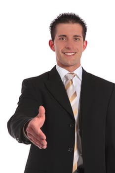 A handsome businessman reaches out his hand. All on white background.