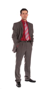 An aspiring businessman standing in front of a plain white background.