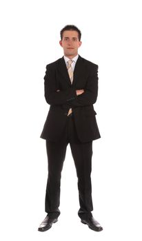 Full length shot of a confident businessman standing in front of a plain white background.