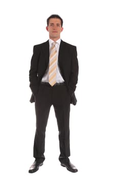 Full length shot of a confident businessman standing in front of a plain white background.