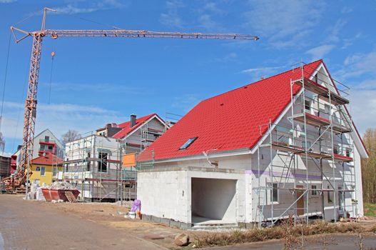 Shell construction of a typical new residential building with scaffolding.