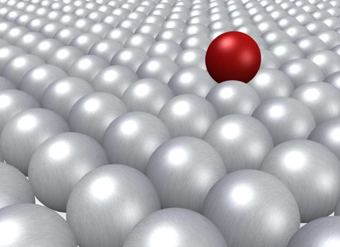 A single red ball lying on a crowd of grey balls.