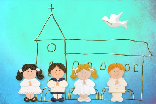 cheerful child card first communion, church and group of children made ??of sugar on blue background