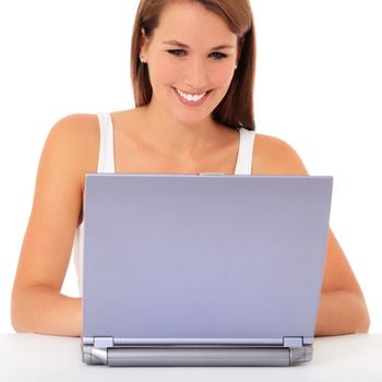 Attractive young woman surfing the internet. All on white background.