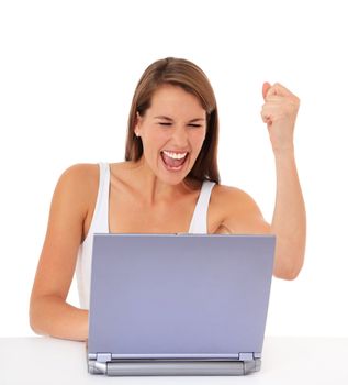 Attractive young woman cheering while using laptop. All on white background.