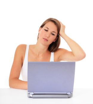 Attractive young woman got a problem with her laptop. All on white background.