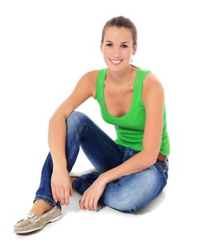 Attractive young woman sitting on the ground. All on white background.