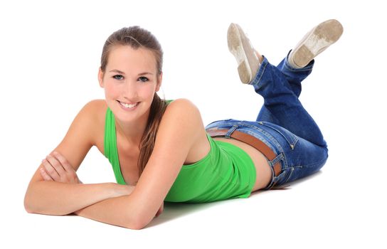 Attractive young woman lying on the ground. All on white background.