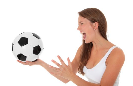 Attractive young woman yelling at soccer ball. All on white background.