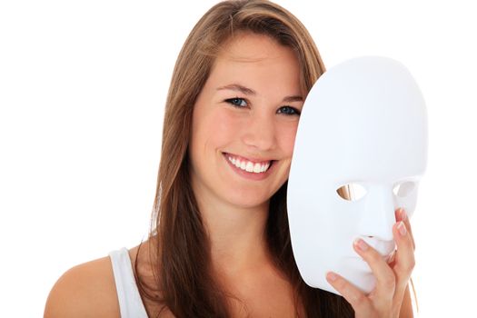 Attractive young woman takes off white mask. All on white background.