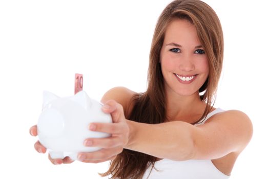 Attractive young woman holding piggy bank. All on white background.