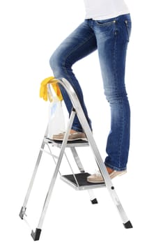 Woman standing on stepladder during housecleaning. All on white background.