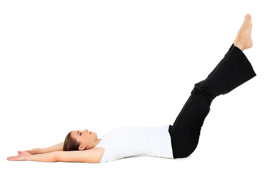 Attractive young woman in sports wear doing gymnastics. All on white background.